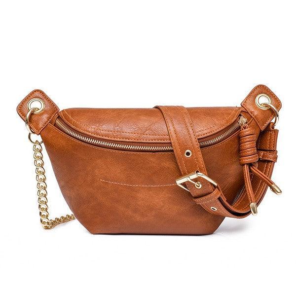 Cognac colored vegan leather crossbody back with gold hardware.