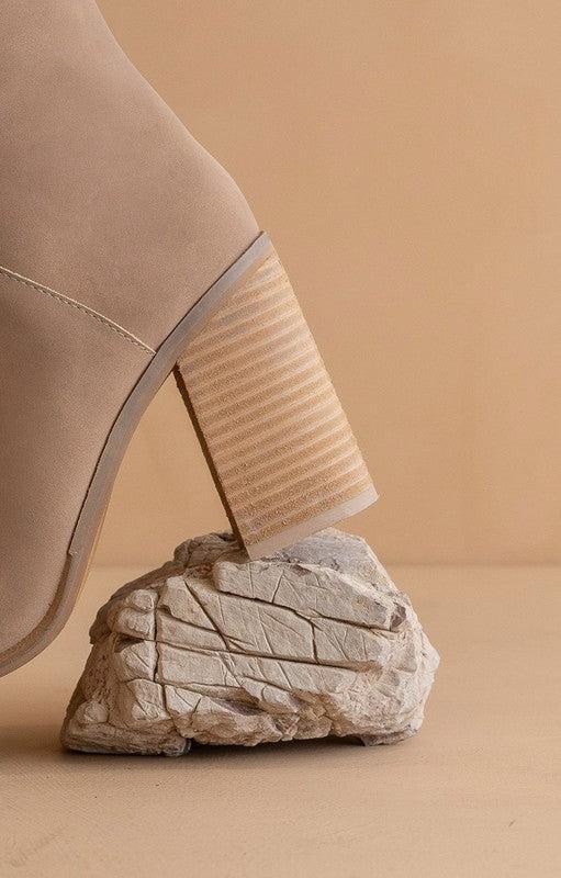 A beautiful tall soft faux suede boot on a stacked heel makes it a versatile staple in any wardrobe.