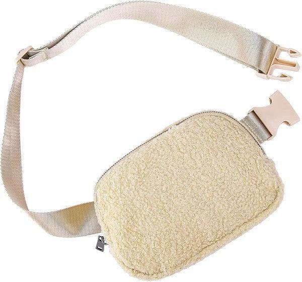 Beige fleece pouch with a strap on a white background