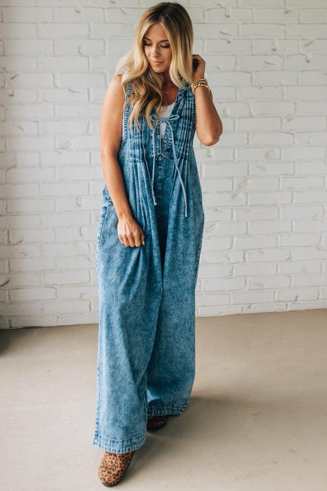 Blonde Woman Wearing a Mineral Washed Pintuck Jumpsuit With Side Pockets.