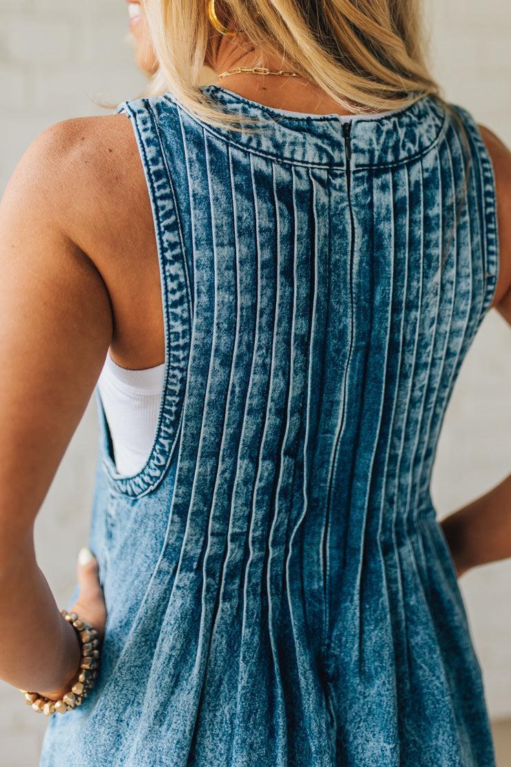 Blonde Woman Wearing a Mineral Washed Pintuck Jumpsuit With Side Pockets.