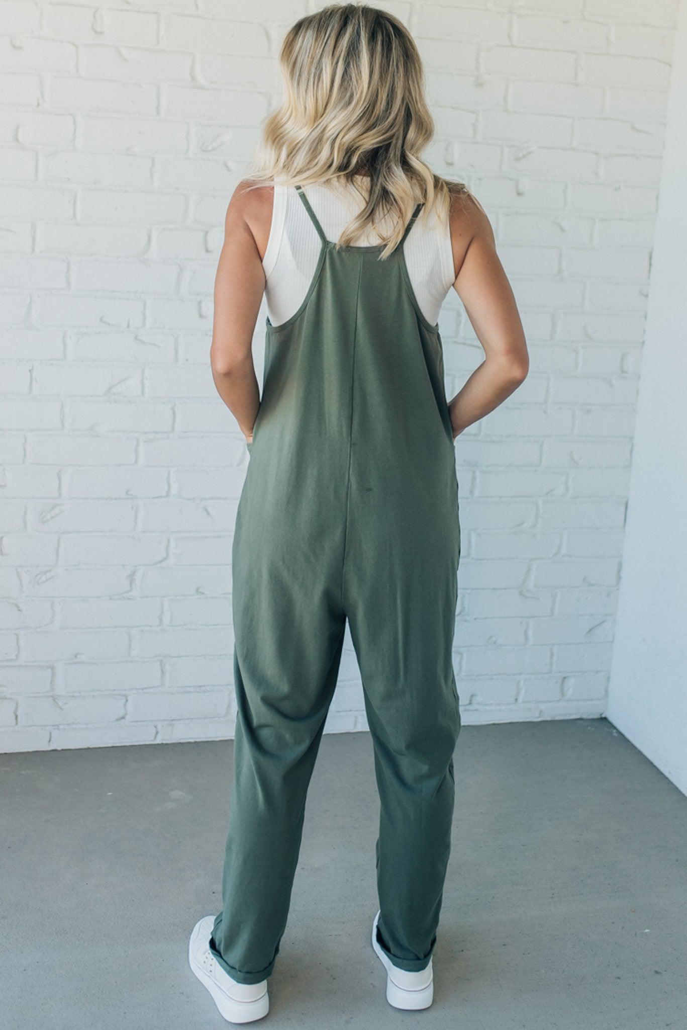 Blonde Woman wearing a white tank with a solid Cotton Relaxed Cami Jumpsuit.