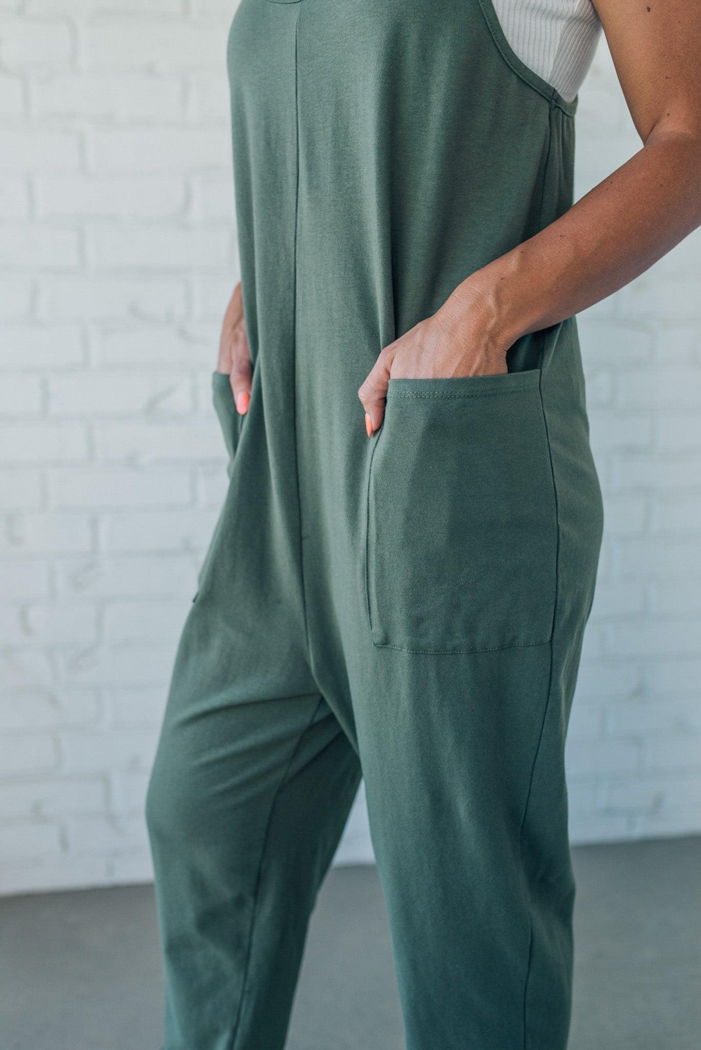 Blonde Woman wearing a white tank with a solid Cotton Relaxed Cami Jumpsuit.