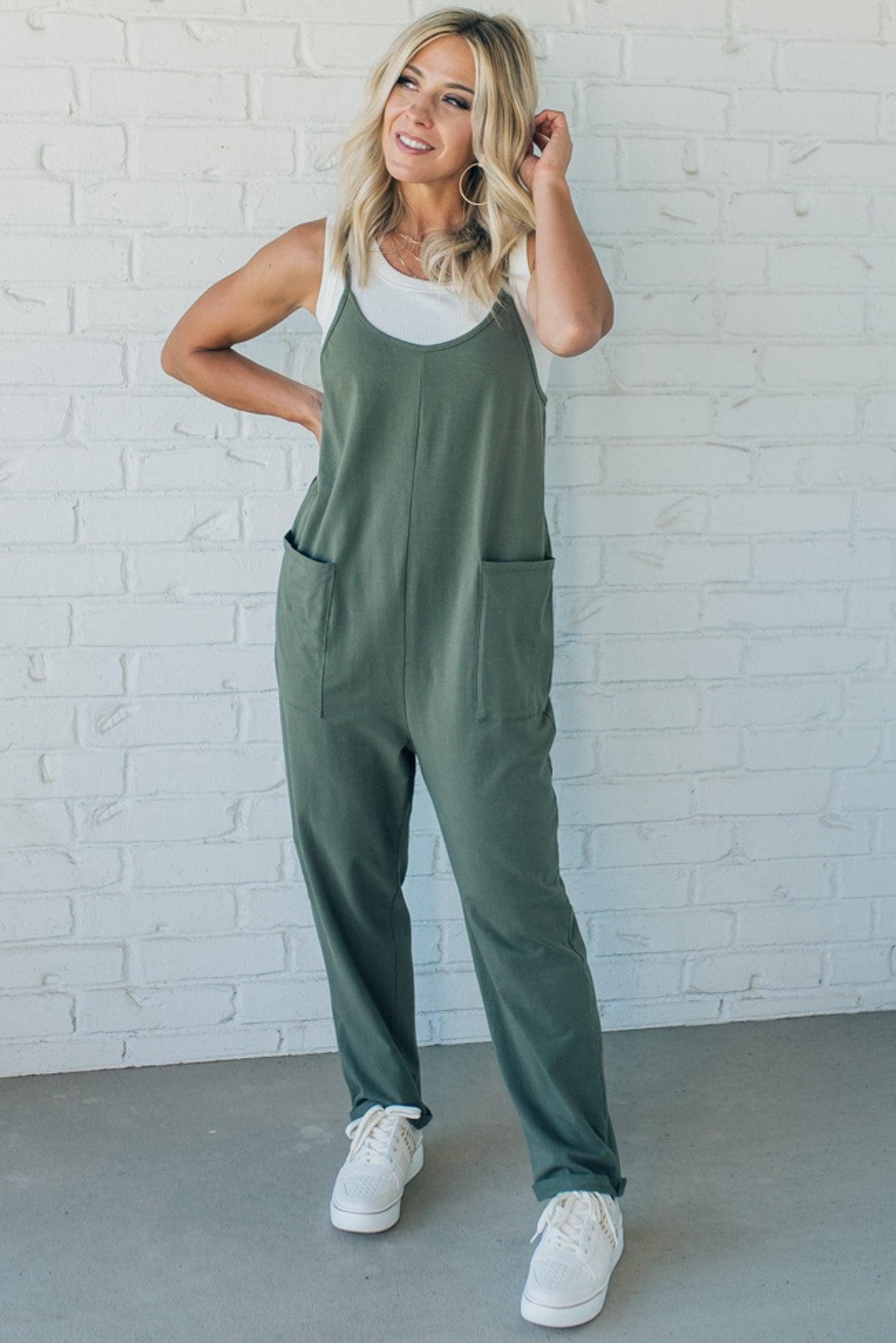 Blonde Woman wearing a white tank with a solid Cotton Relaxed Cami Jumpsuit.
