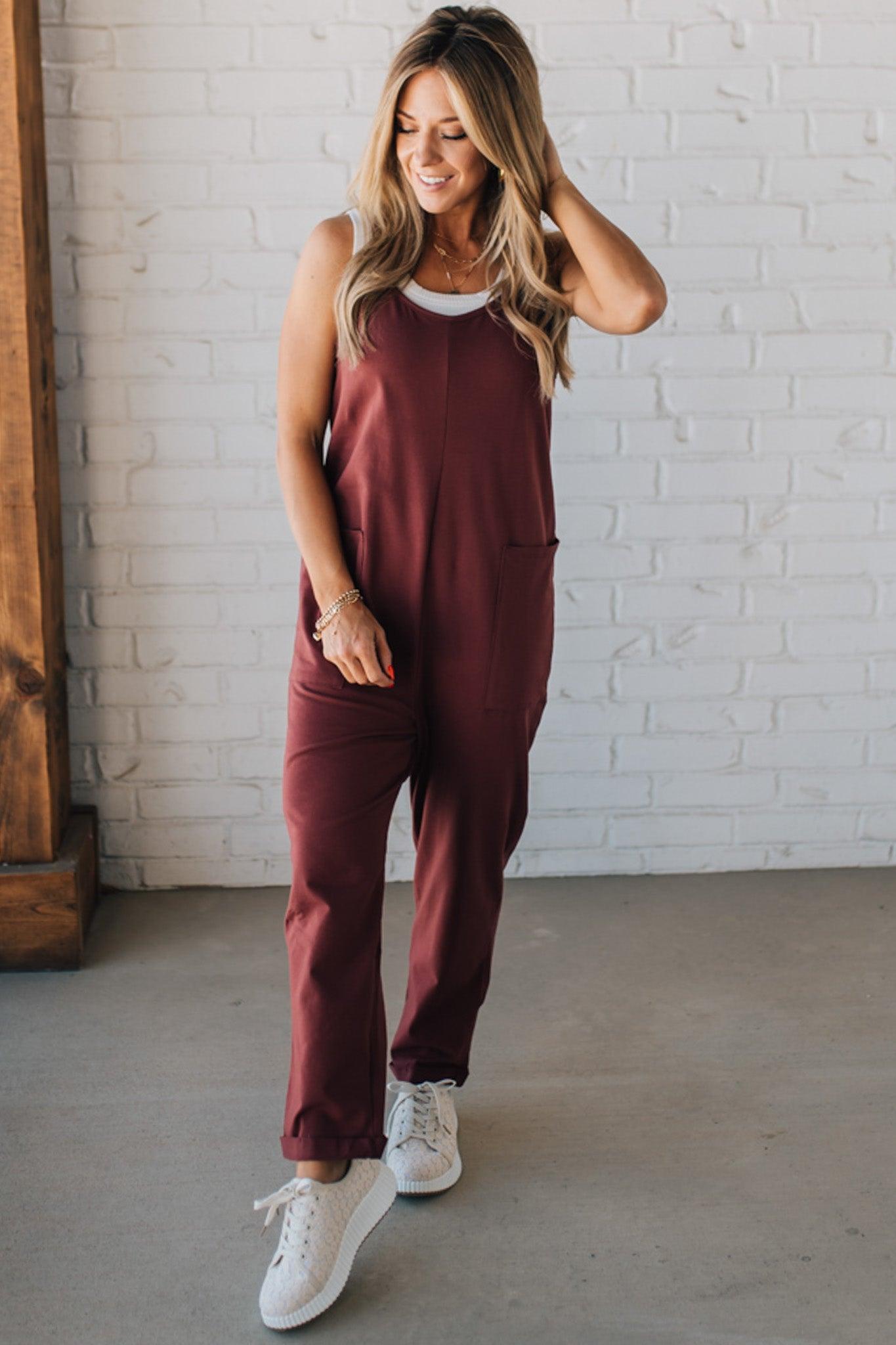 Blonde Woman wearing a white tank with a solid Cotton Relaxed Cami Jumpsuit.