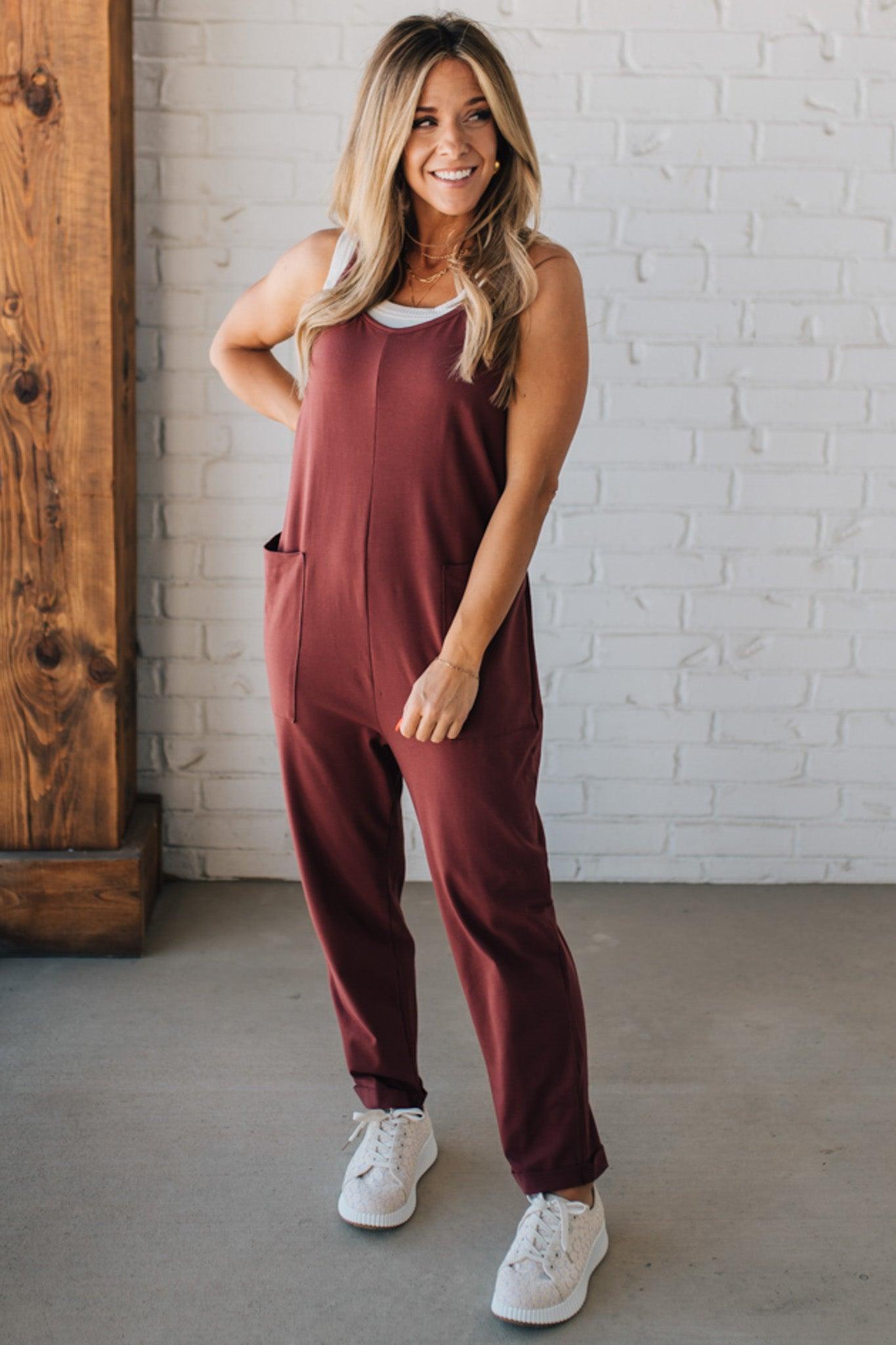 Blonde Woman wearing a white tank with a solid Cotton Relaxed Cami Jumpsuit.