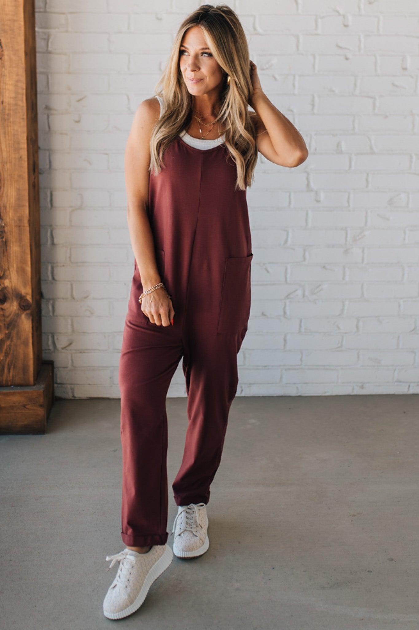 Blonde Woman wearing a white tank with a solid Cotton Relaxed Cami Jumpsuit.