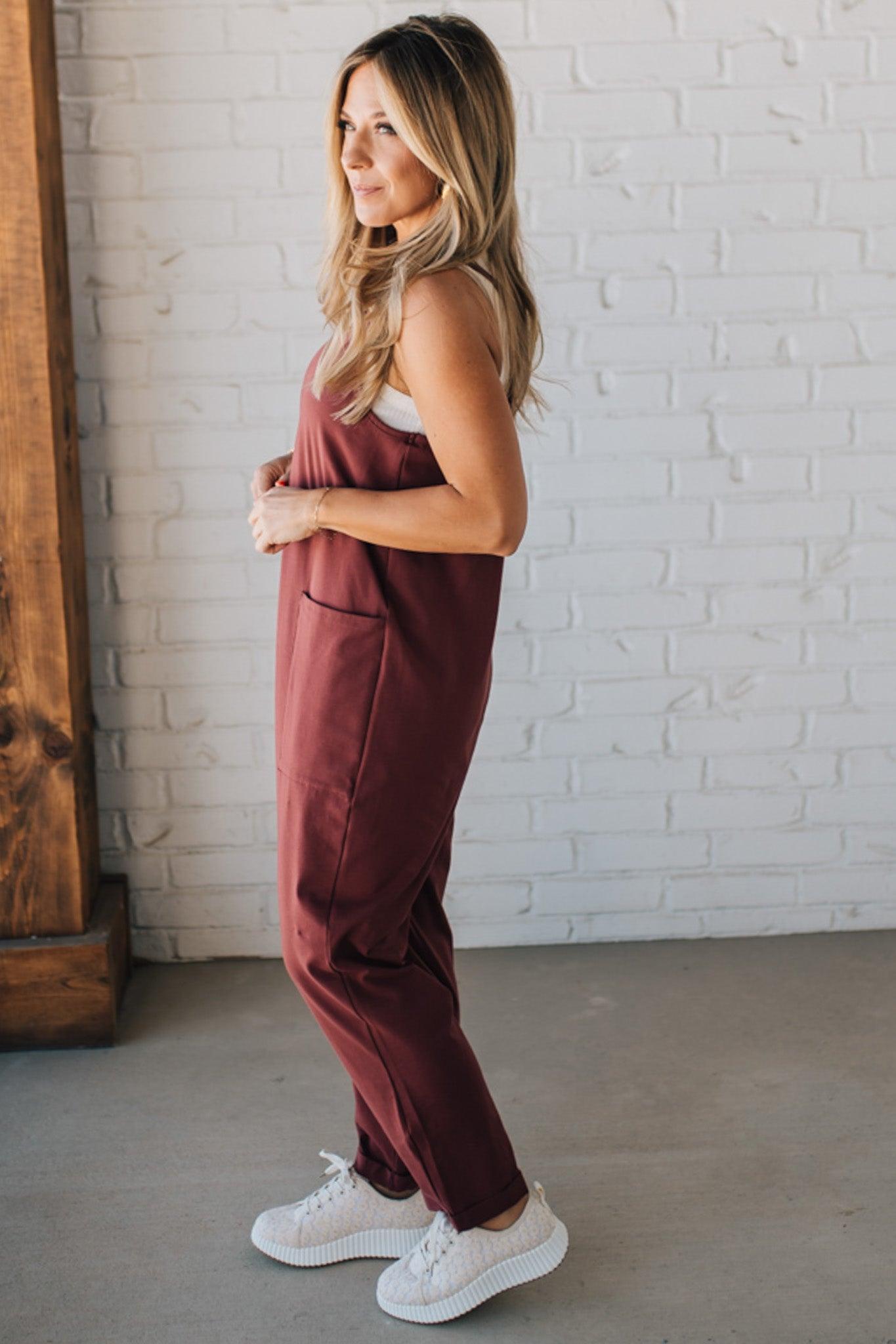 Blonde Woman wearing a white tank with a solid Cotton Relaxed Cami Jumpsuit.