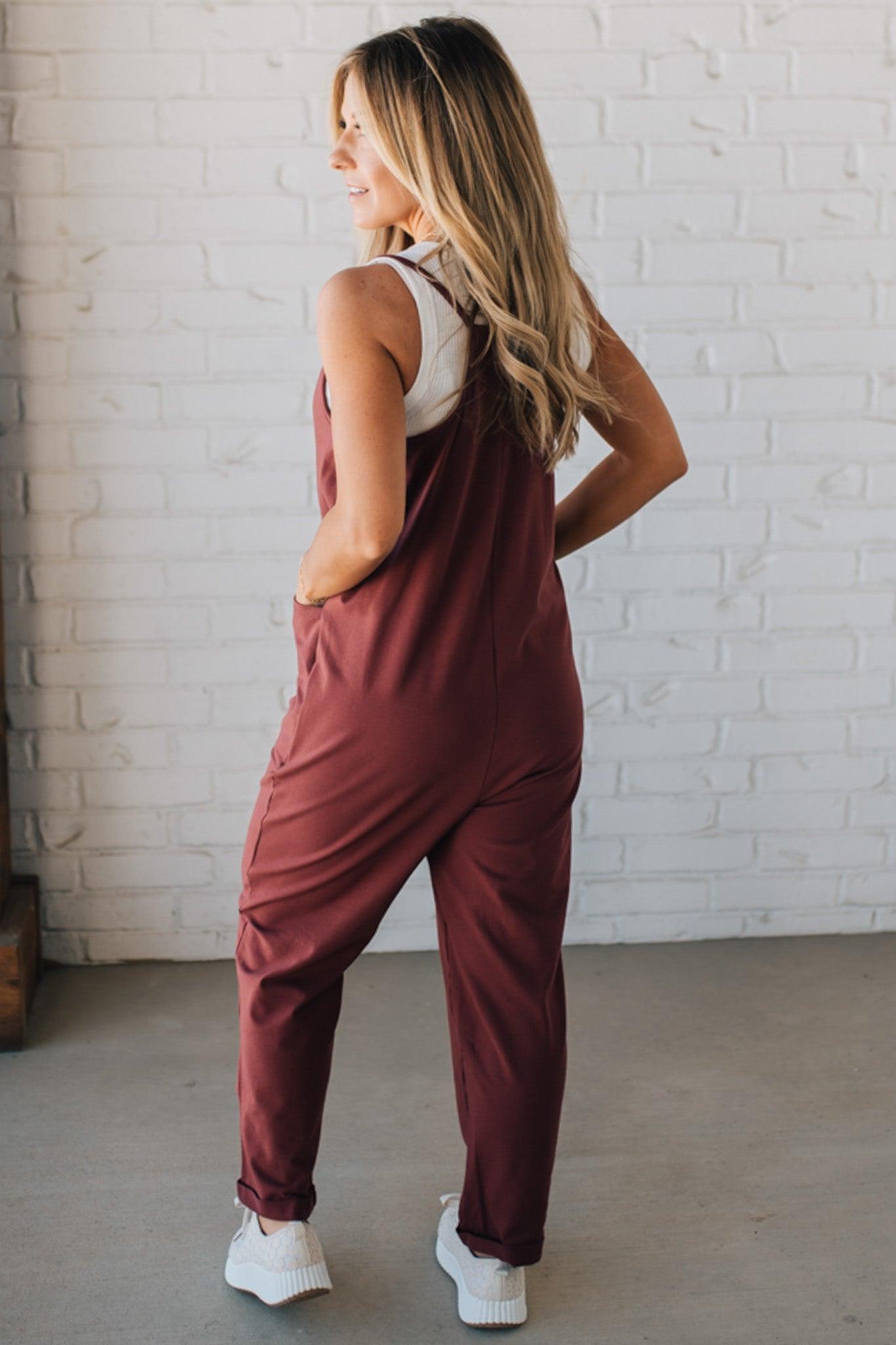 Blonde Woman wearing a white tank with a solid Cotton Relaxed Cami Jumpsuit.