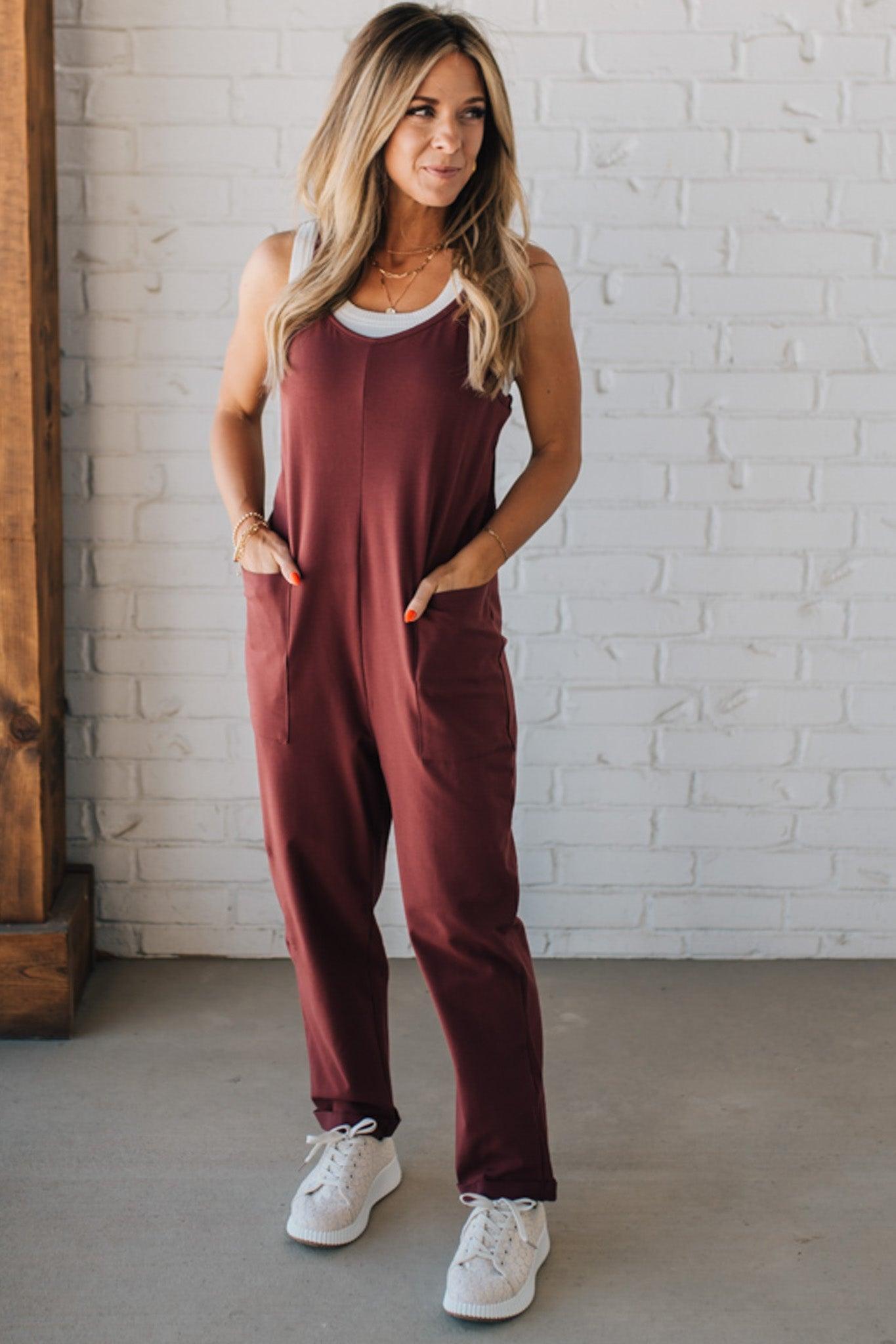 Blonde Woman wearing a white tank with a solid Cotton Relaxed Cami Jumpsuit.