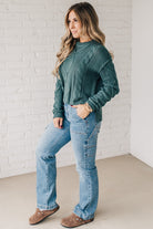 Blonde girl modeling a mocha long sleeve cable knit sweater