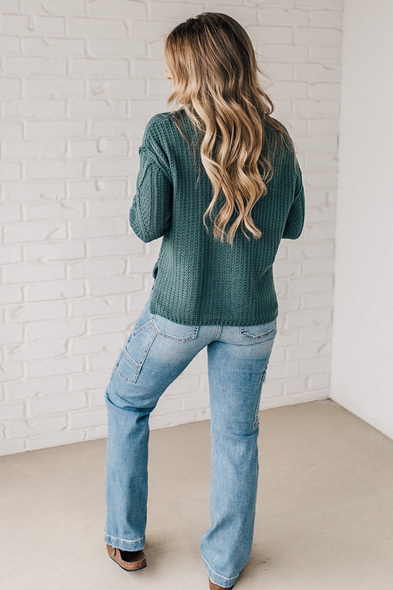 Blonde girl modeling a mocha long sleeve cable knit sweater