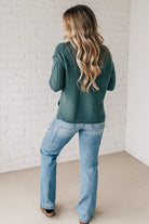 Blonde girl modeling a mocha long sleeve cable knit sweater