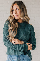 Blonde girl modeling a mocha long sleeve cable knit sweater