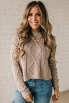 Blonde girl modeling a mocha long sleeve cable knit sweater