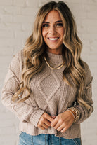 Blonde girl modeling a mocha long sleeve cable knit sweater