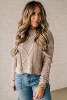 Blonde girl modeling a mocha long sleeve cable knit sweater