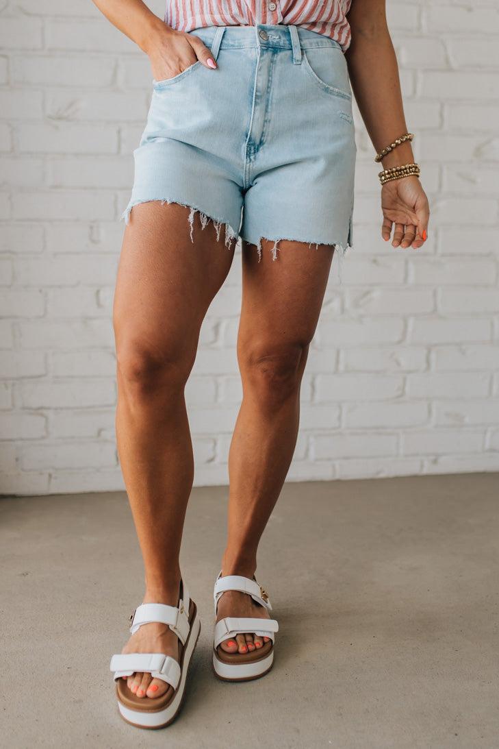 Woman Wearing Light Wash Comfort Stretch Distressed Hem Denim Shorts