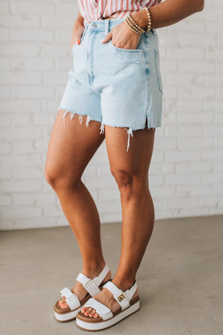 Woman Wearing Light Wash Comfort Stretch Distressed Hem Denim Shorts