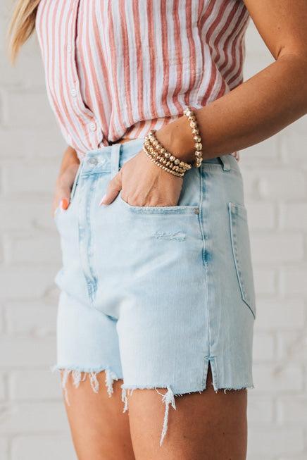 Woman Wearing Light Wash Comfort Stretch Distressed Hem Denim Shorts