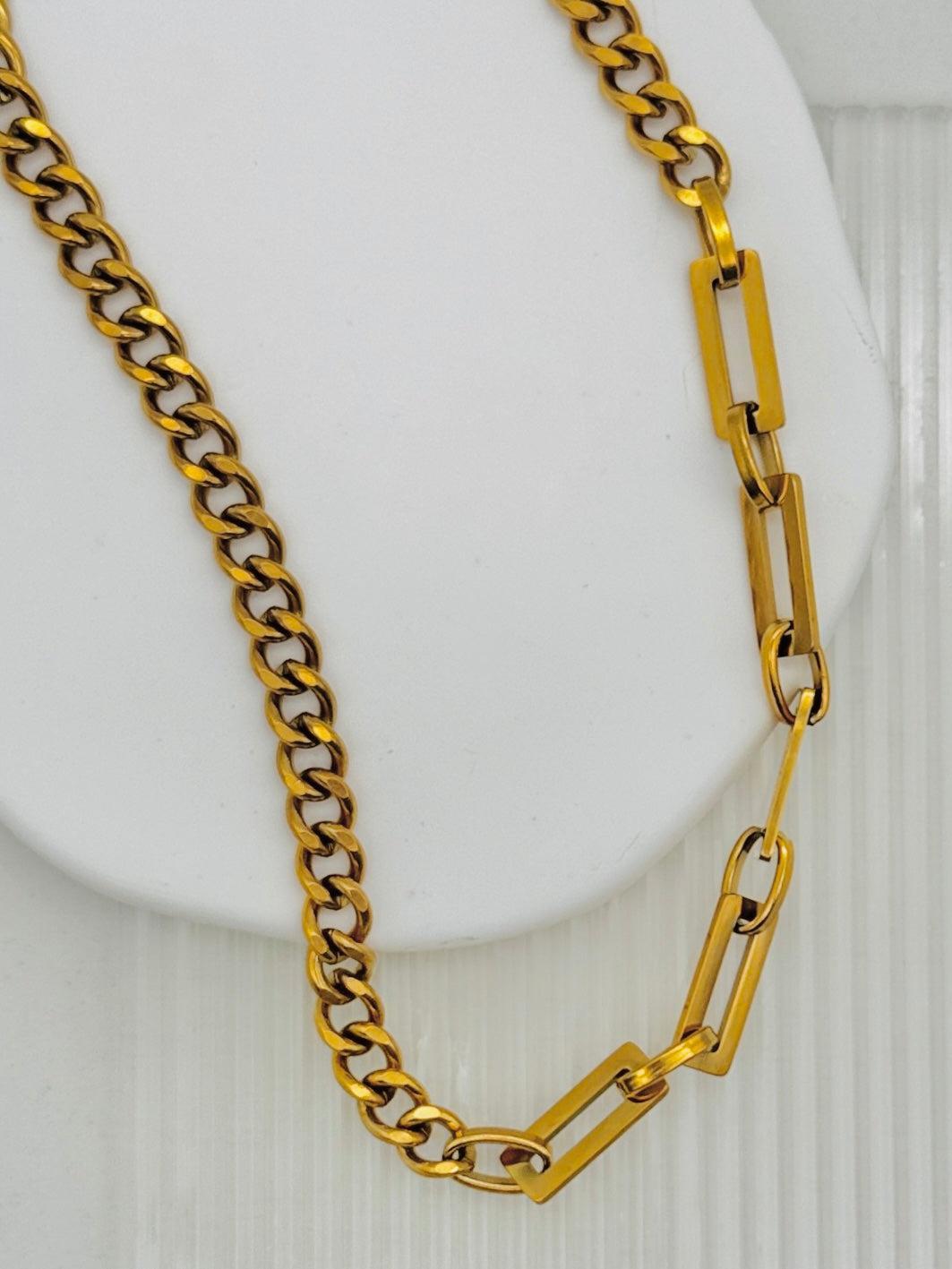 Gold chain necklace on a white background