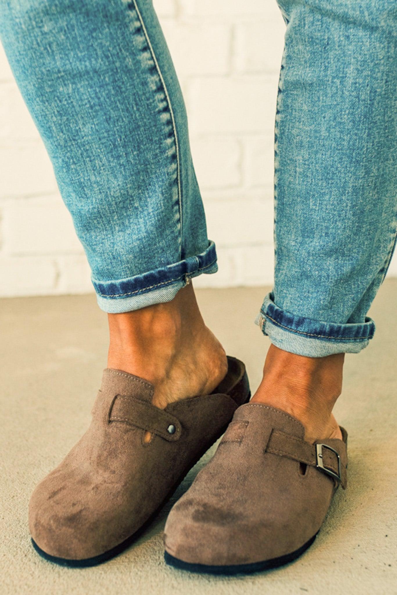 Taupe colored slip on clog with silver buckle