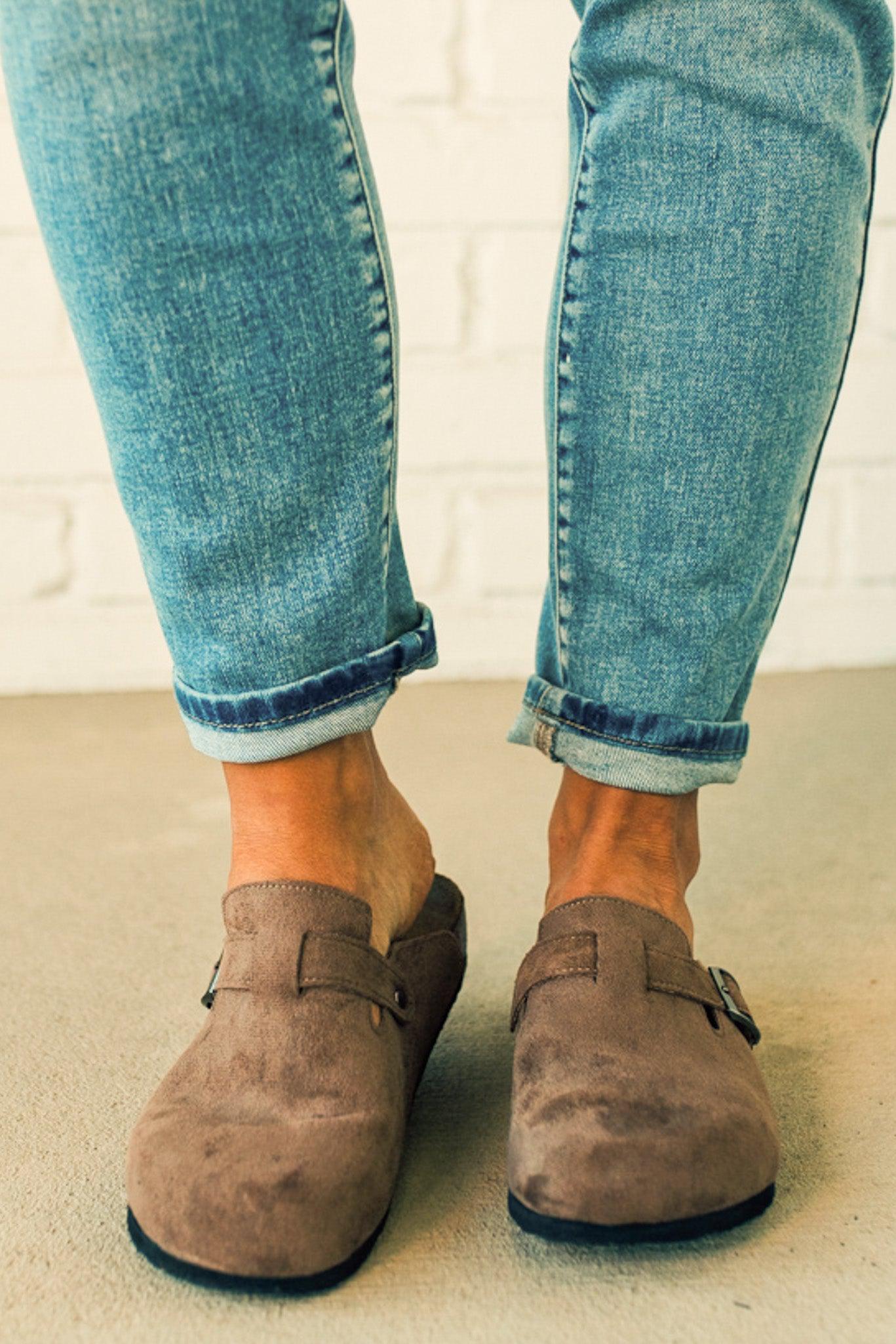 Taupe colored slip on clog with silver buckle