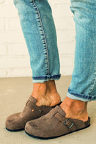 Taupe colored slip on clog with silver buckle