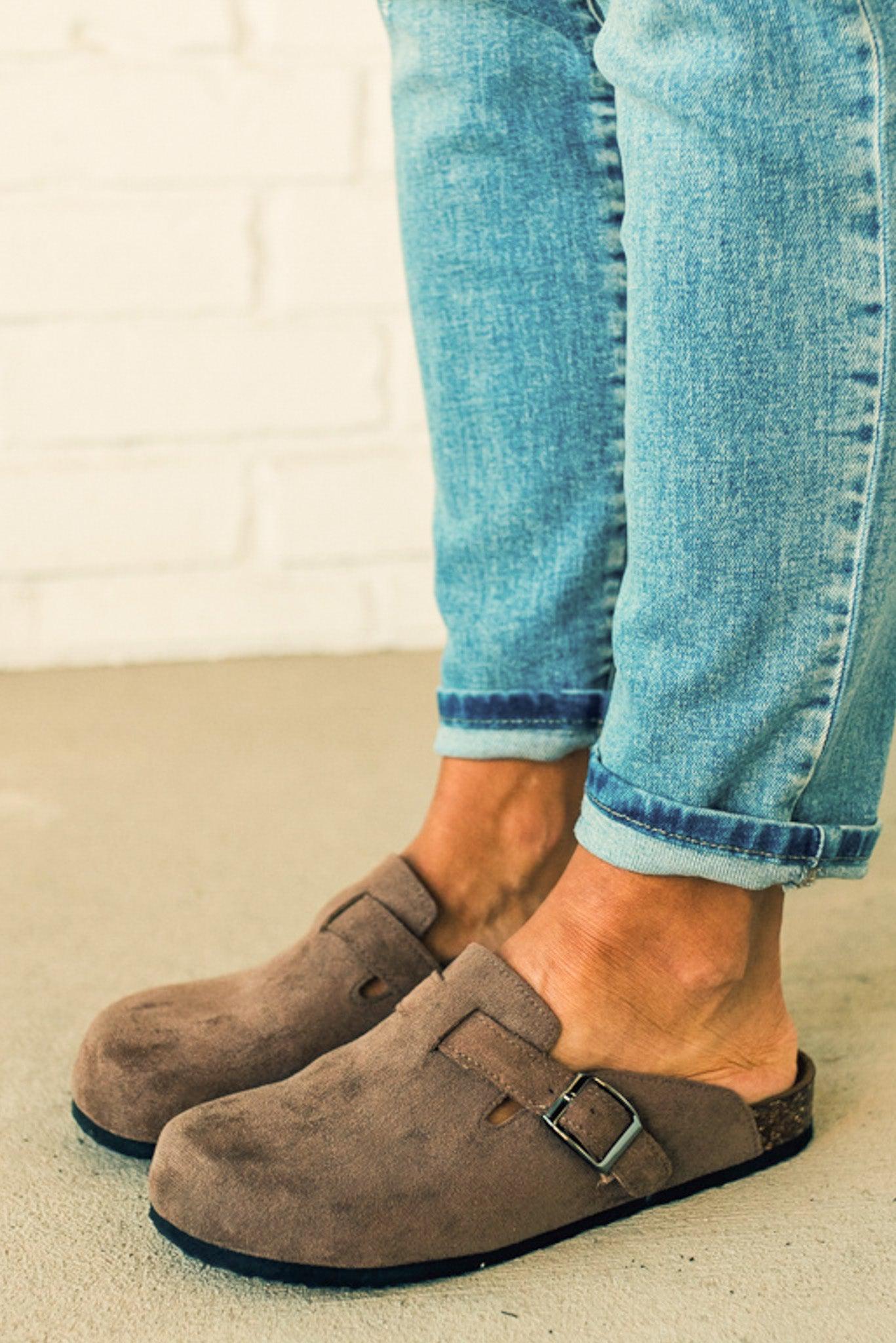 Taupe colored slip on clog with silver buckle