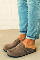 Taupe colored slip on clog with silver buckle