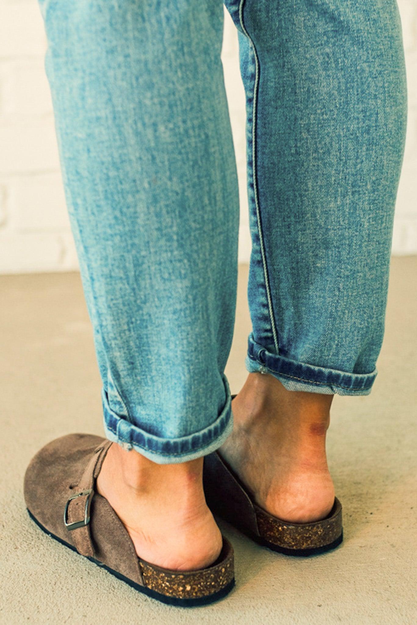 Taupe colored slip on clog with silver buckle