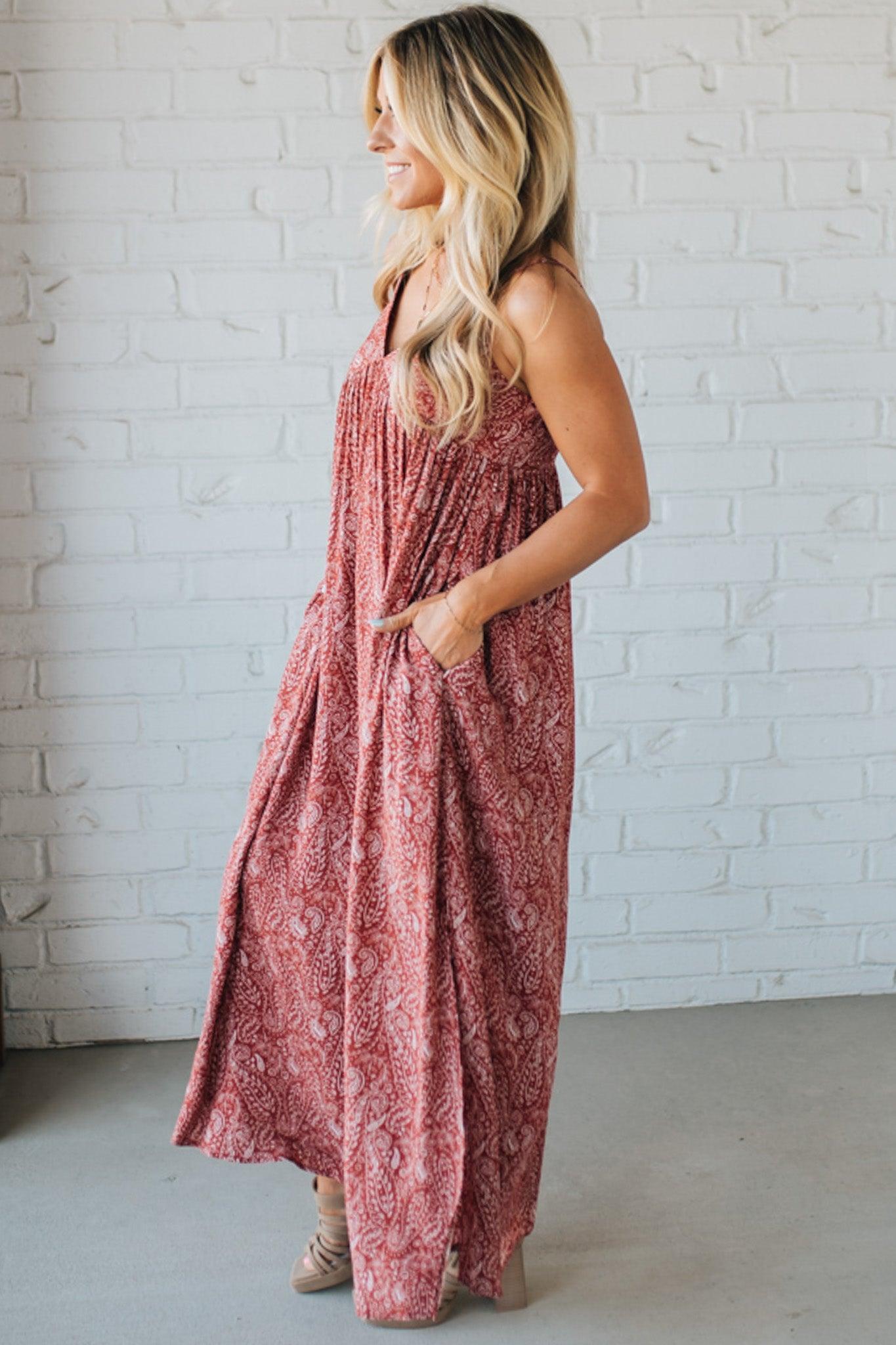 Blonde woman wearing a red Paisley Print Maxi Dress With Adjustable Straps.
