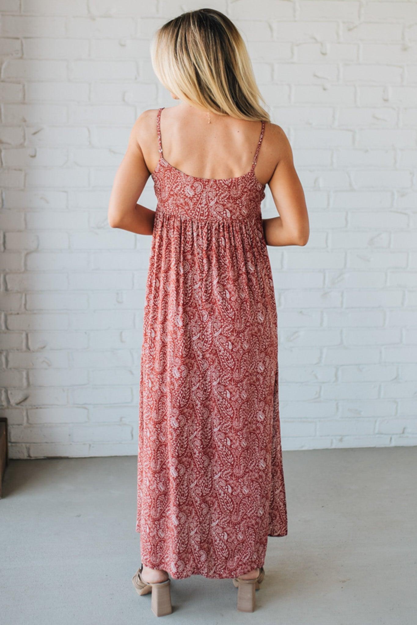 Blonde woman wearing a red Paisley Print Maxi Dress With Adjustable Straps.