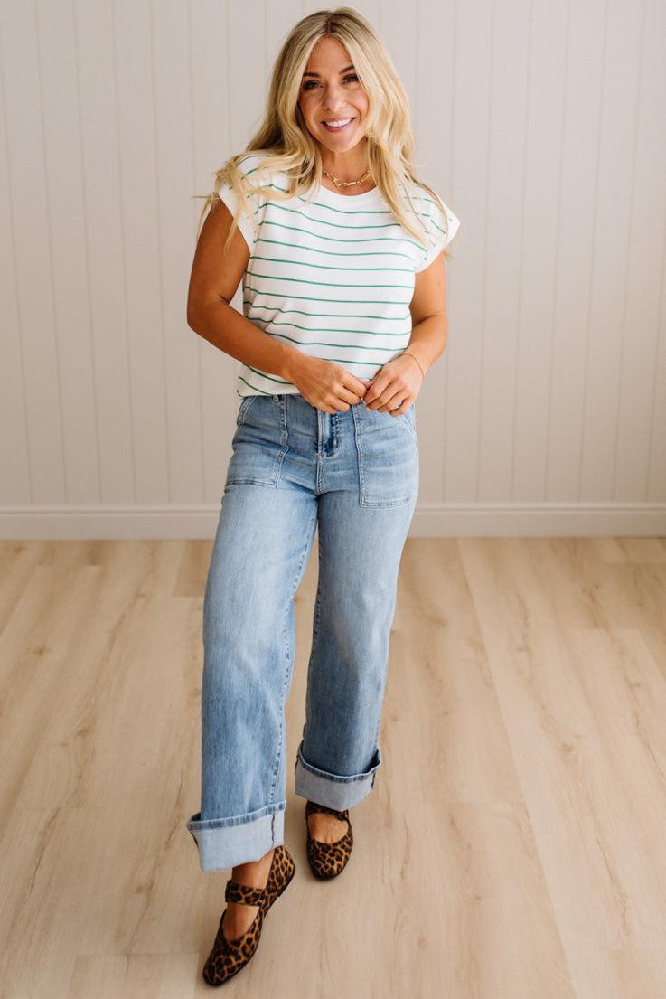 BLONDE WOMAN WEARING A STRIPED, CREW NECK, EXTENDED DOLMAN SHORT SLEEVE, EVERYDAY SWEATER TOP, IN IVORY WITH THIN KELLY GREEN STRIPE