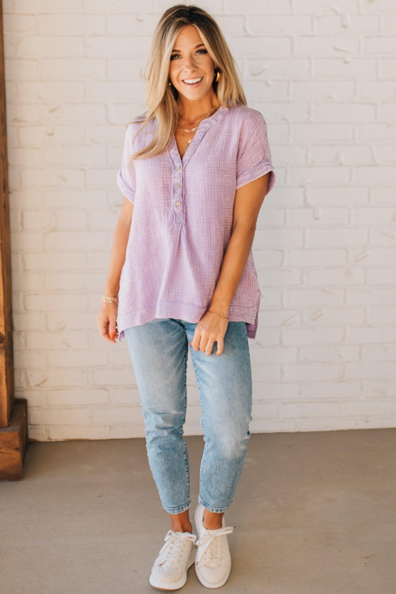 BLONDE WOMAN WEARING A WASHED DOUBLE GAUZE 3/4 BUTTON HENLEY NECK SHIRT.