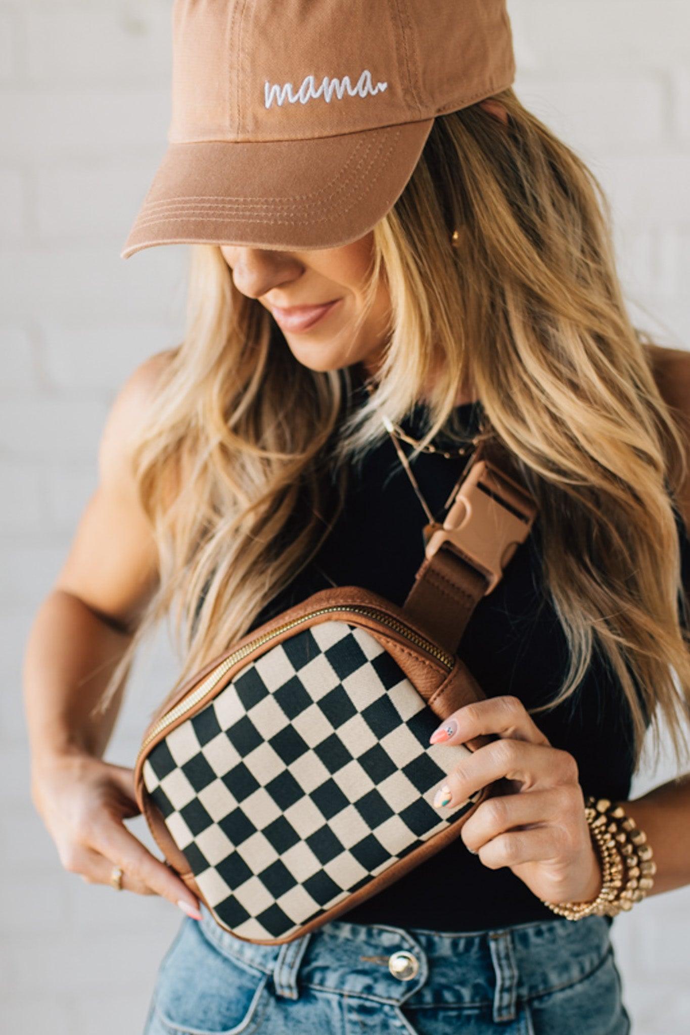 Blonde Woman in a Hat with a Mixed Texture Check Sling Belt Bum Bag across her body.