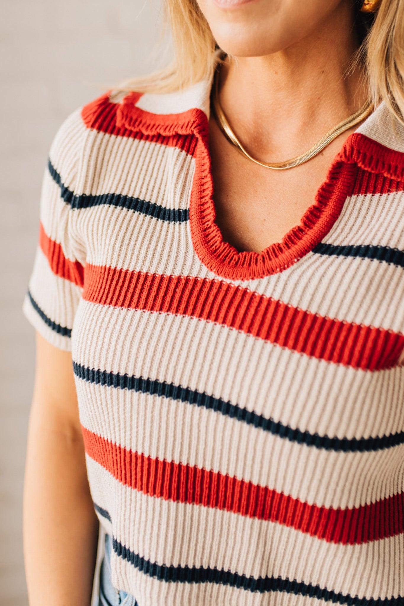 Blonde Woman in a White Hat Wearing a Striped Collared Short Sleeve Cropped Sweater
