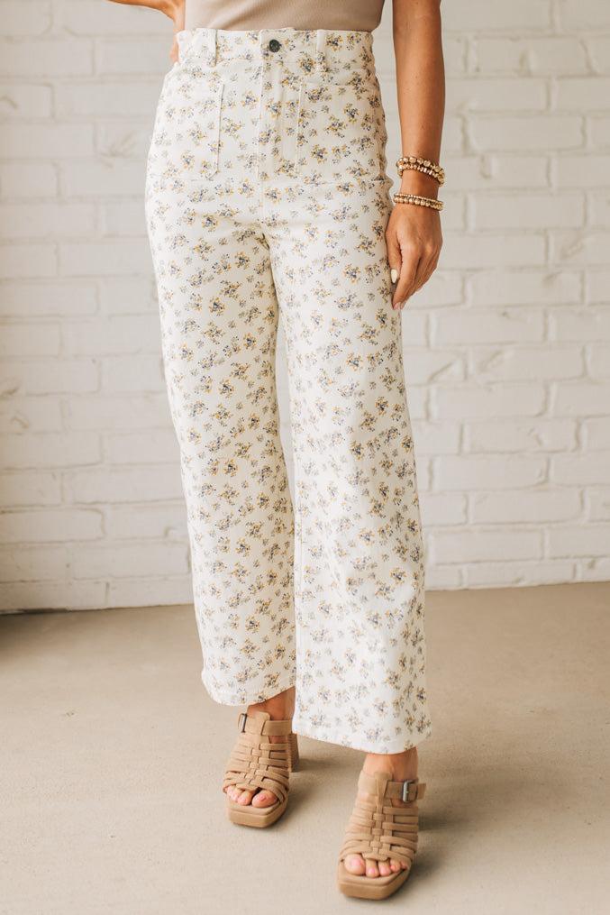 Blonde woman wearing Ditsy Floral Printed Front Pocket Stretch Wide Leg Jeans.