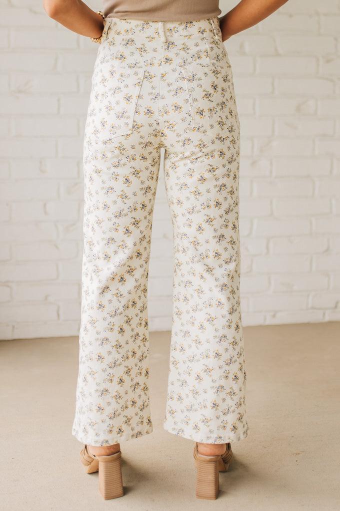 Blonde woman wearing Ditsy Floral Printed Front Pocket Stretch Wide Leg Jeans.