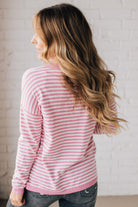 BLONDE WOMAN MODELING A LONG SLEEVE STRIPED LIGHTWEIGHT SWEATER WITH RIBBED SOLID COLORED NECKLINE AND SLEEVE CUFFS
