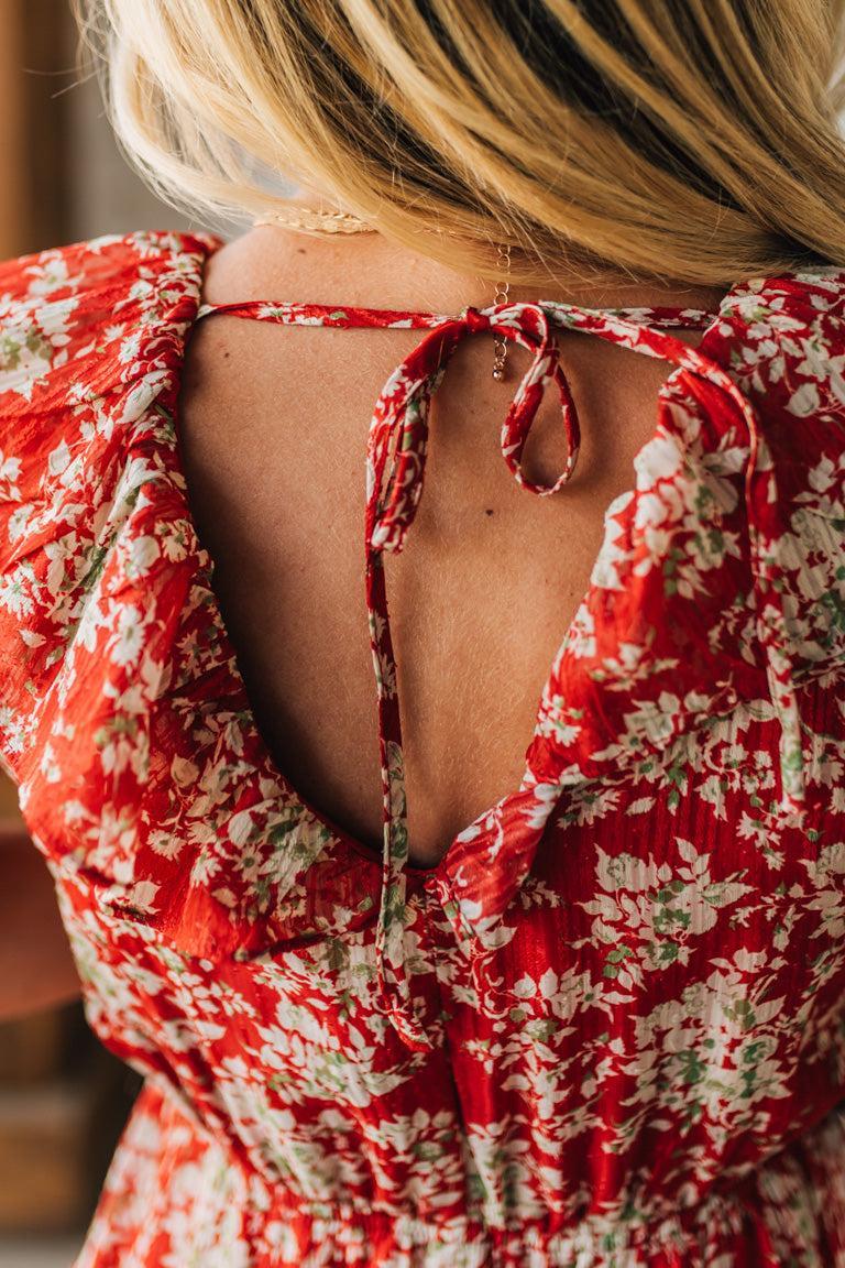 Red floral dress with a backless design