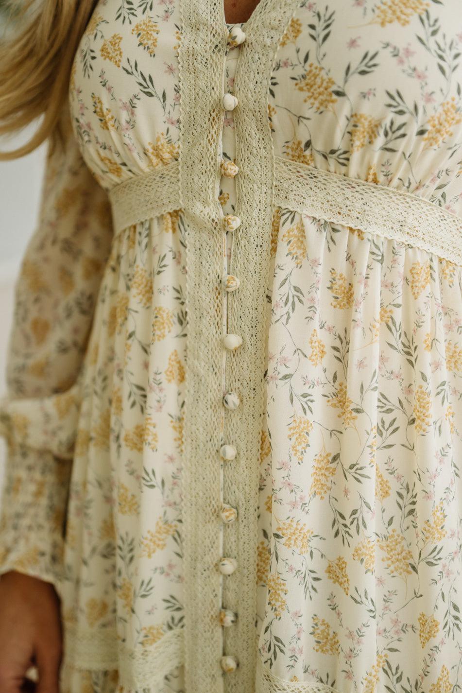 Floral dress with button details on a white background