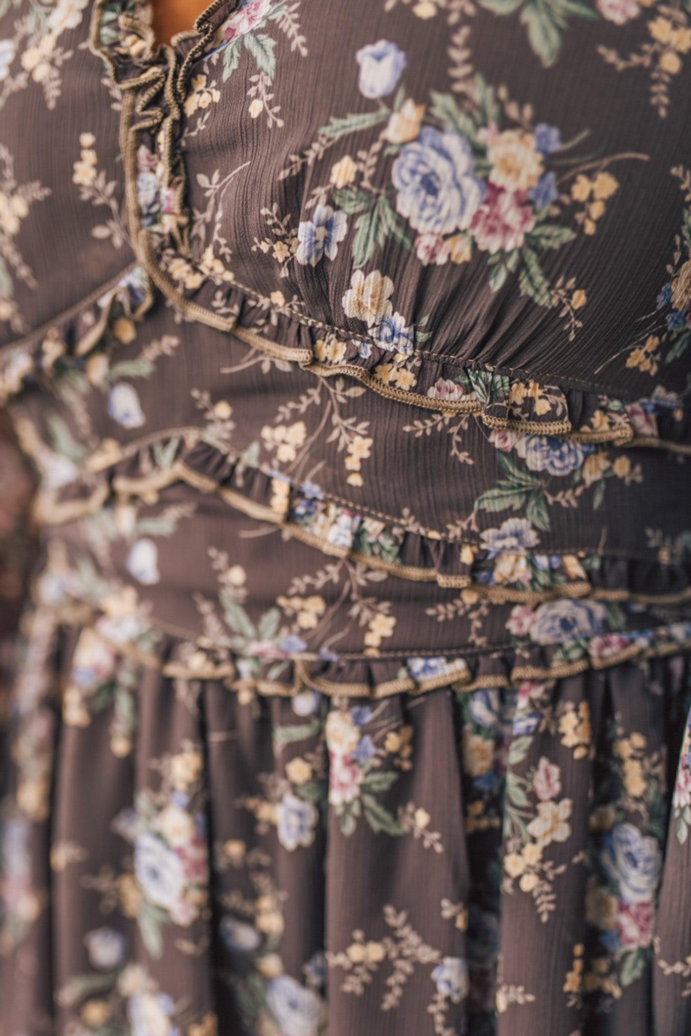 Close-up of a floral dress with a brown background