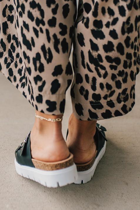 Women's Chunky Two Strap Sandal in black faux leather and white sole.