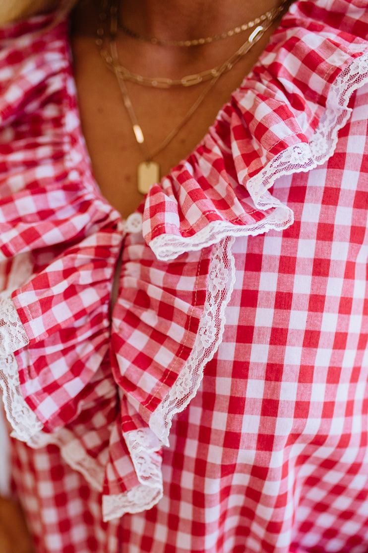 Red and white checkered blouse with ruffled details