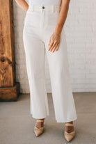 High waist wide leg denim with scissor cut hem in crisp white.