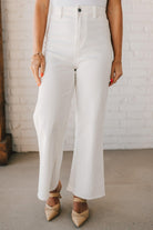 High waist wide leg denim with scissor cut hem in crisp white.