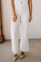 High waist wide leg denim with scissor cut hem in crisp white.