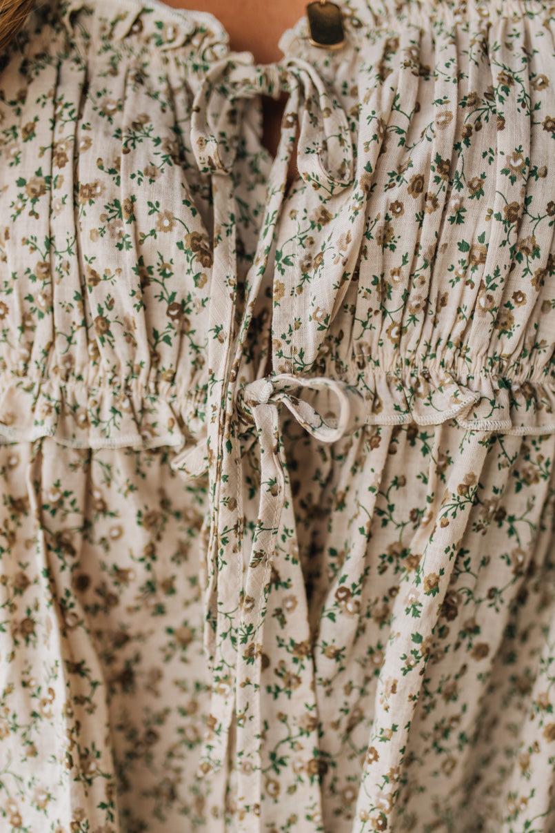 Close-up of a floral dress with ruffled details