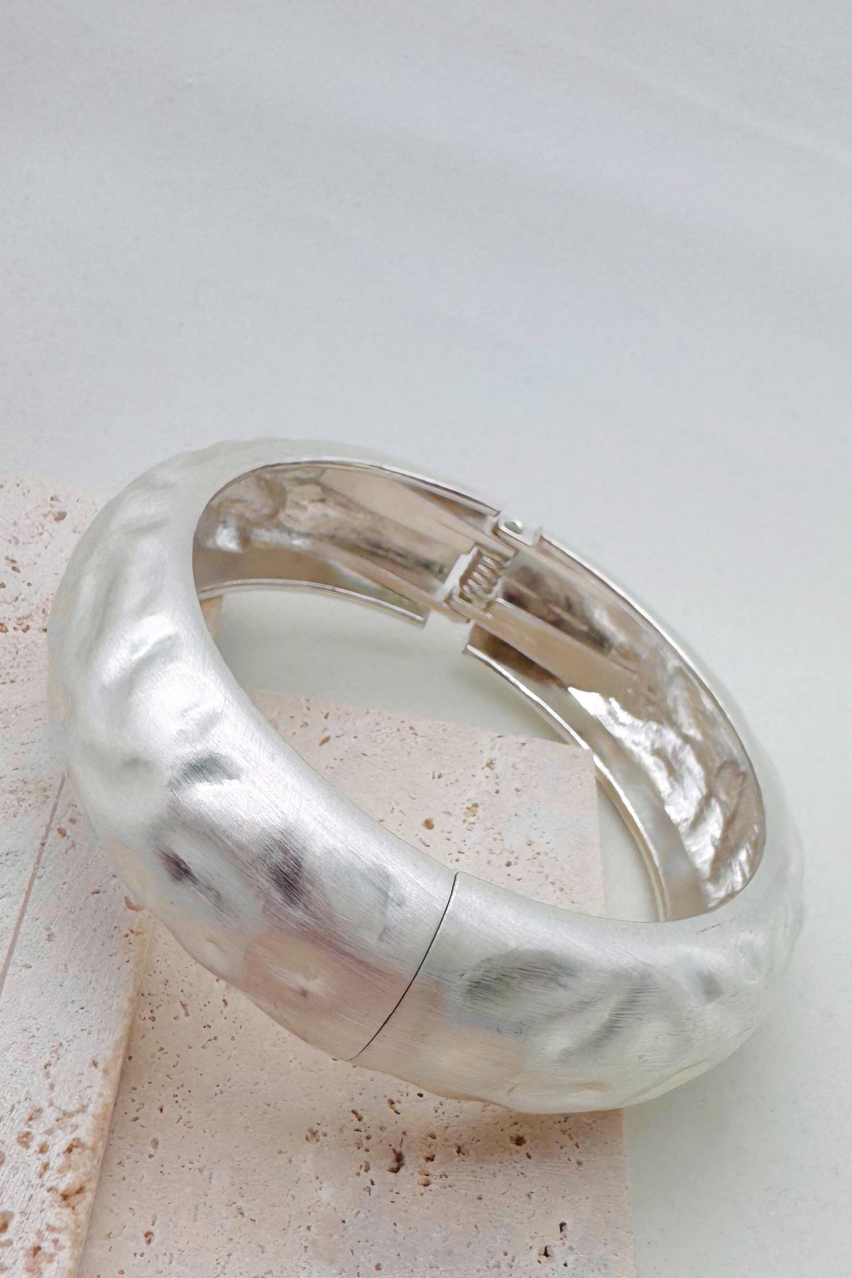 Pile of mixed metal bangle bracelets.